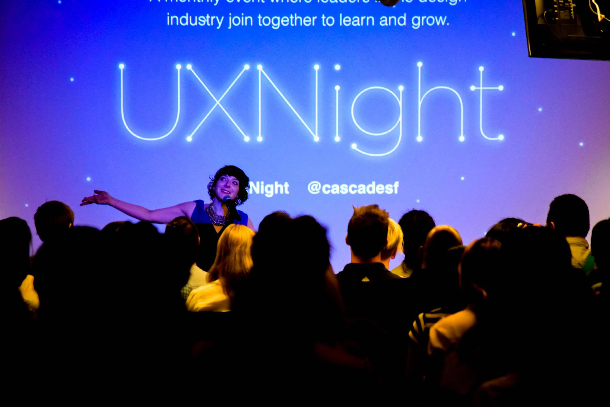 Andi Galpern hosting a Cascade SF UX Night in front of a full crowd