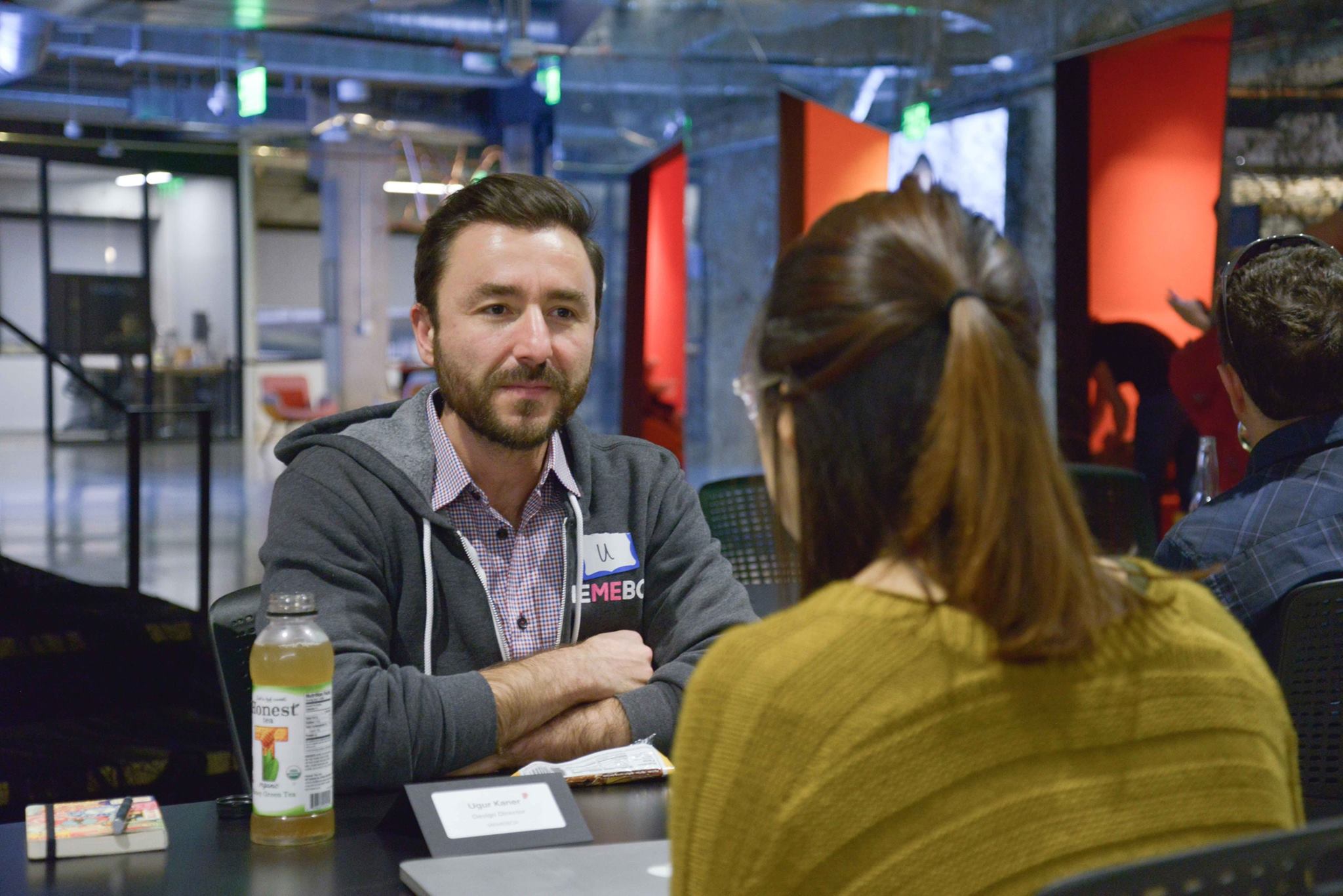 A mentor in a one-on-one conversation with a designer