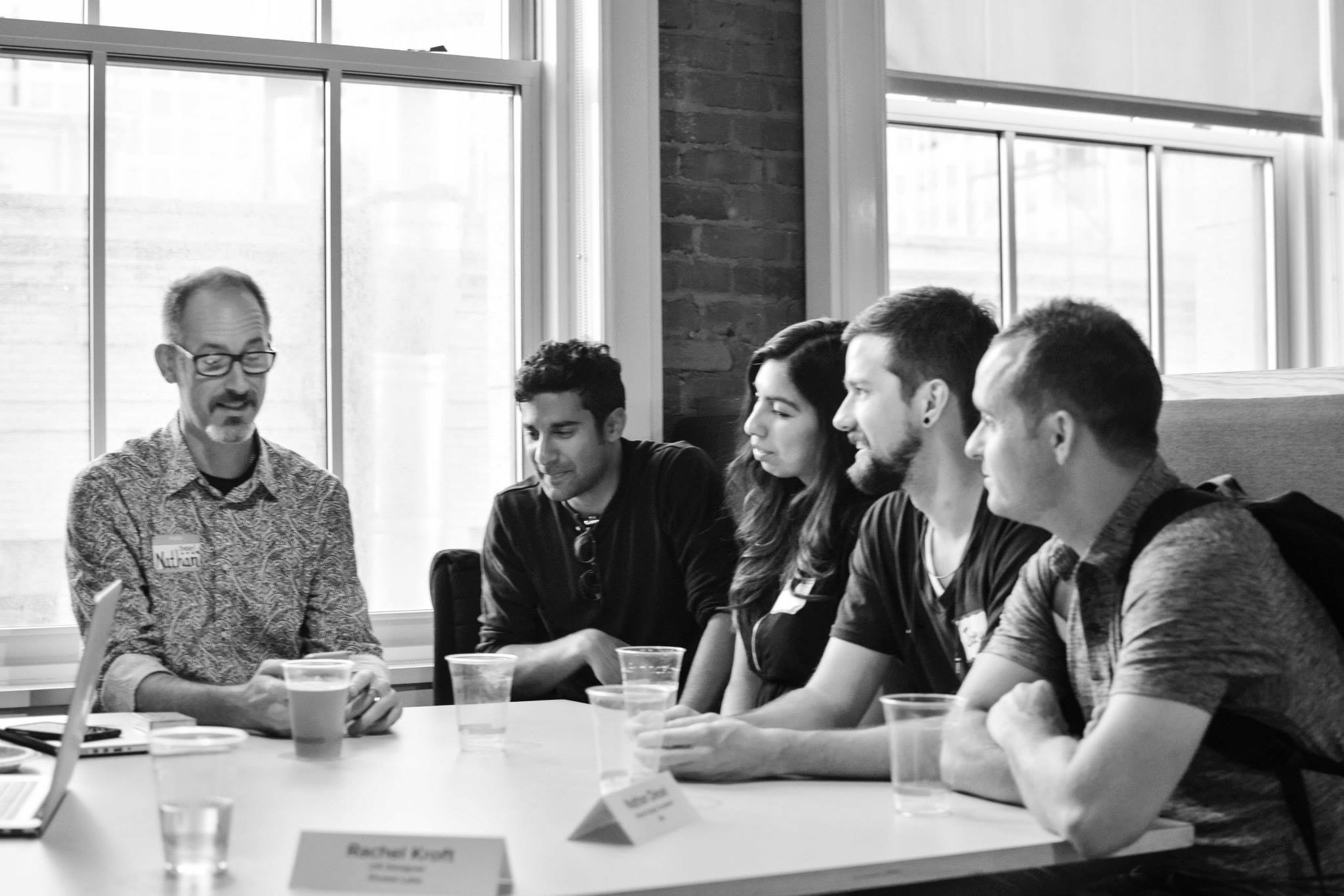 Mentors and attendees in conversation around a table at a Cascade SF event